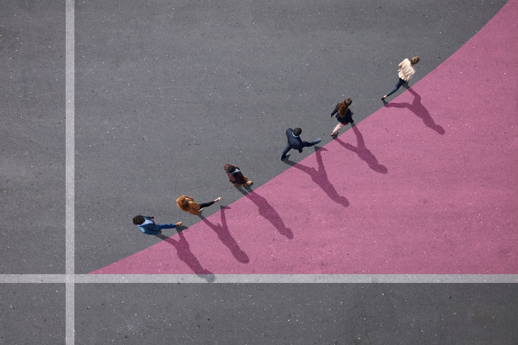 Group of young adults, photographed from above, on various painted tarmac surface, at sunrise.