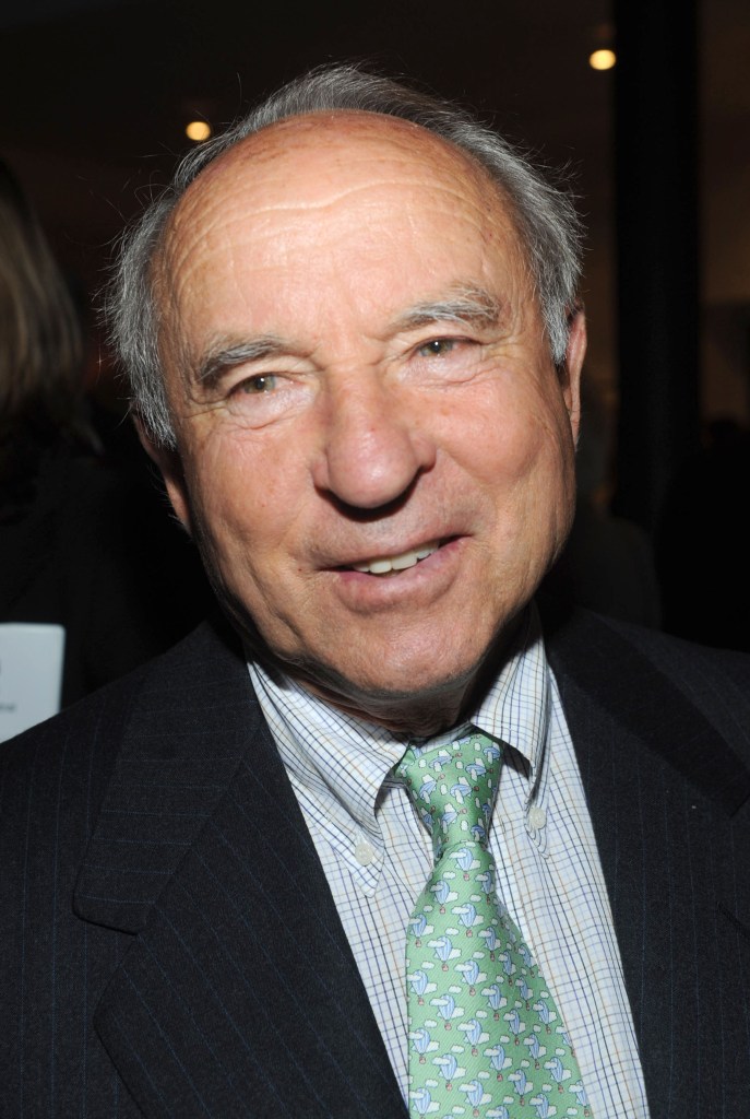Yvon Chouinard, founder and owner of Patagonia, smiling as he walks at night through New York City.